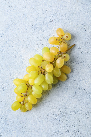 bunch of sweet grapes on light backgroundの写真素材