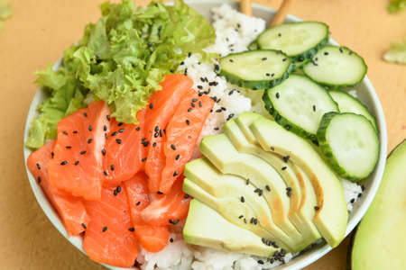 Tasty poke bowl on color background, closeup