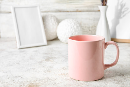 Stylish pink cup on tableの写真素材