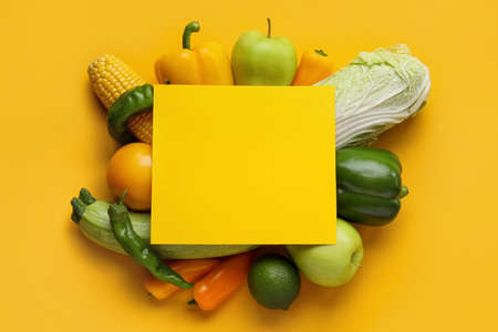 Composition with vegetables, fruits and blank card on color background. Vegan Dayの写真素材