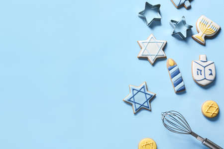 Tasty cookies for Hanukkah celebration on color backgroundの写真素材