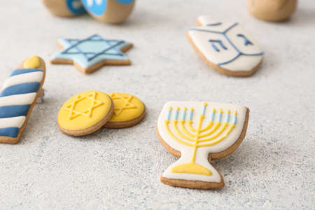 Tasty cookies for Hanukkah celebration on gray backgroundの写真素材