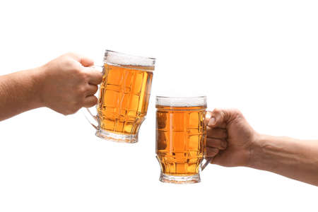 Hands with mugs of beer on white backgroundの写真素材
