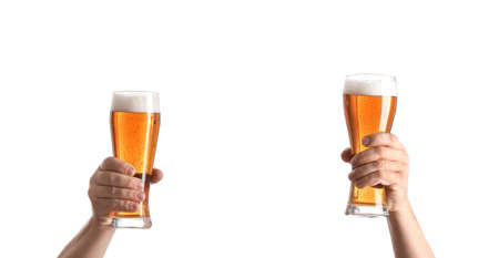 Hands with glasses of beer on white backgroundの写真素材