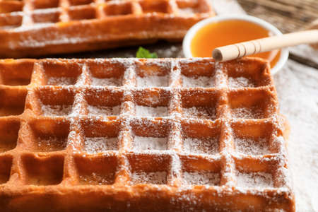Delicious Belgian waffle on table, closeupの写真素材