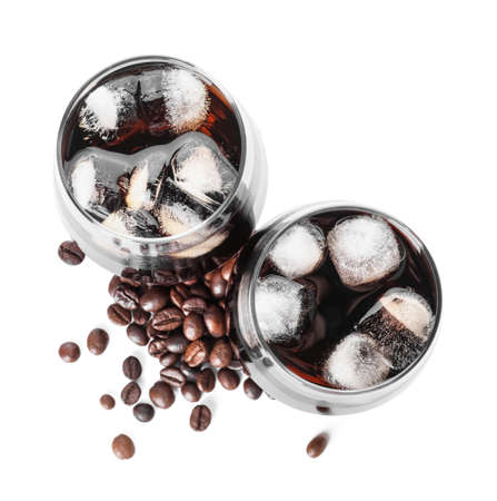Glasses of cold brew and coffee beans on white background