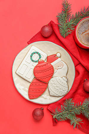 Plate with beautiful Christmas cookies on color backgroundの写真素材
