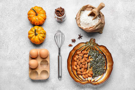 Ingredients for preparing tasty pumpkin pie on light backgroundの写真素材