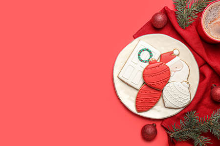 Plate with beautiful Christmas cookies on color backgroundの写真素材