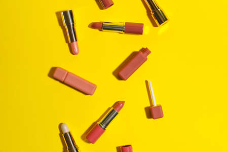 Set of different lipsticks on yellow backgroundの写真素材