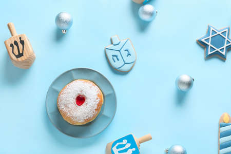 Symbols of Hanukkah with Christmas decor on color backgroundの写真素材