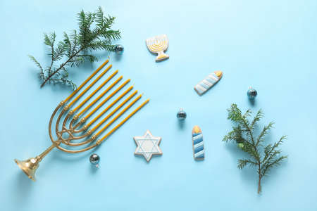 Cookies for Hanukkah celebration with menorah and Christmas decor on color backgroundの写真素材