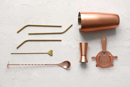 Copper cocktail utensils on gray backgroundの写真素材
