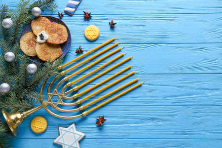 Symbols of Hanukkah and Christmas decor on color wooden backgroundの写真素材
