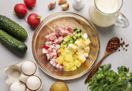 Ingredients for preparing tasty okroshka on gray background, closeup