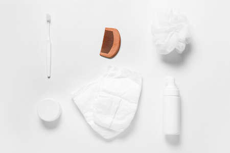 Wooden hair comb and different accessories for baby on white backgroundの写真素材