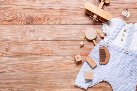 Baby boy clothes and accessories on wooden backgroundの写真素材