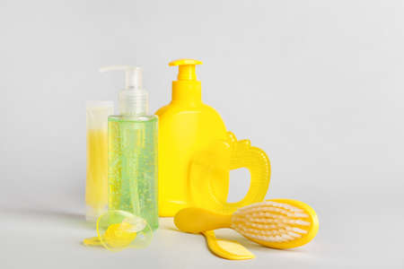 Bath accessories for baby and pacifier on light background