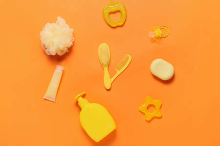 Clock made of bath accessories for baby on color backgroundの写真素材