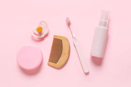 Bath accessories for baby girl on pink background