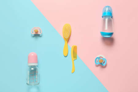 Different accessories for baby boy and girl on color backgroundの写真素材