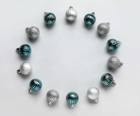 Frame made of beautiful Christmas balls on white background
