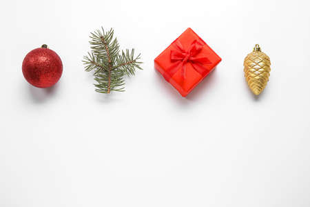 Fir branch, gift box and Christmas decorations on white backgroundの写真素材