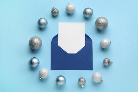 Frame made of balls and Christmas blank greeting card on color backgroundの写真素材