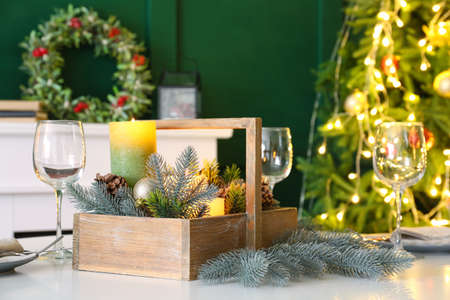Table setting with Christmas decor in living roomの写真素材