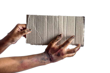 Hands of zombie with empty paper sheet on white backgroundの写真素材