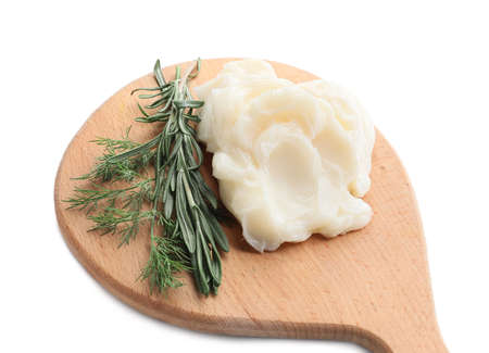 Board with lard and herbs on white background