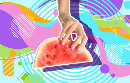 Hand with slice of ripe watermelon on colorful backgroundの写真素材
