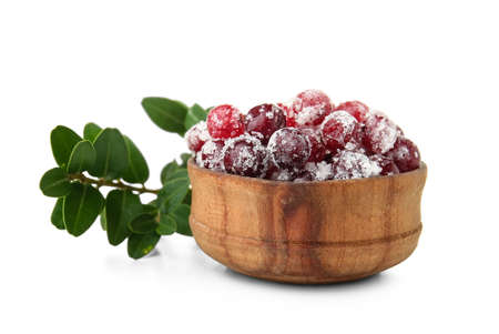 Bowl with tasty sugared cranberries on white backgroundの写真素材