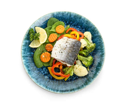 Plate of tasty sea bass fish with vegetables on white backgroundの写真素材