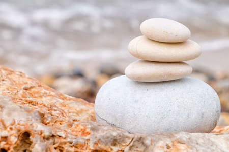 Stack of pebbles on sea beachの写真素材