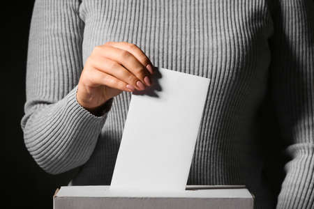 Voting woman near ballot box, closeupの写真素材