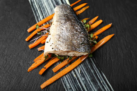 Tasty sea bass fish on black backgroundの写真素材