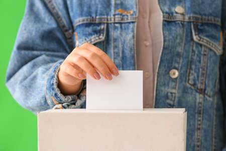 Voting woman near ballot box, closeupの写真素材