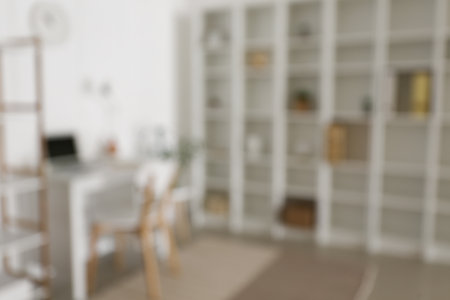 Blurred view of modern workplace with big shelving unitの写真素材