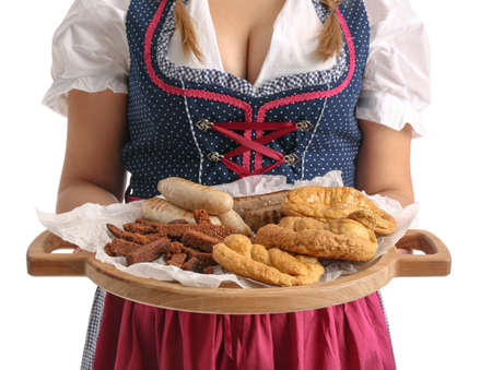 Young Octoberfest waitress with food on white backgroundの写真素材