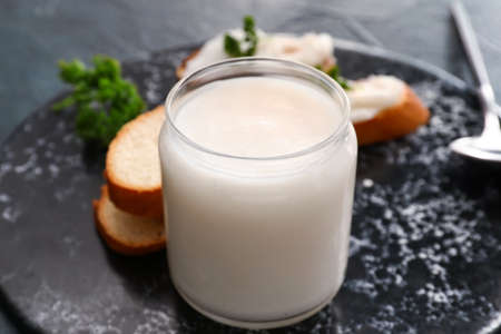 Jar of lard spread on black backgroundの写真素材