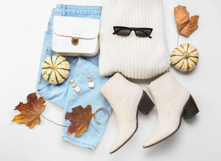 Stylish female clothes, accessories and autumn decor on white backgroundの写真素材