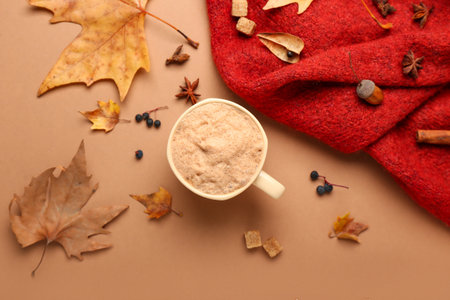 Autumn composition with cup of coffee on color backgroundの写真素材