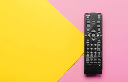 Modern TV remote control on color background