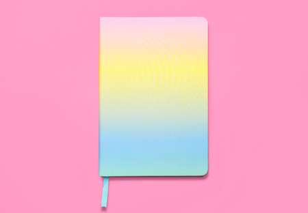 colorful notebook on pink backgroundの写真素材