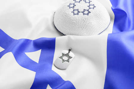 Military tag and kippah on flag of Israelの写真素材