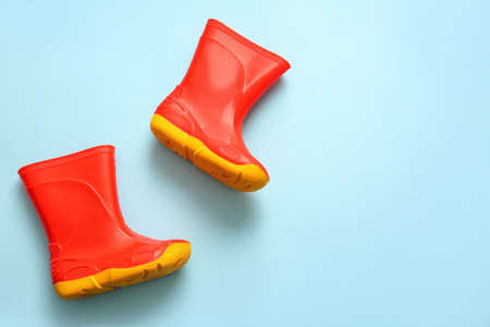 Pair of rubber boots on blue backgroundの写真素材