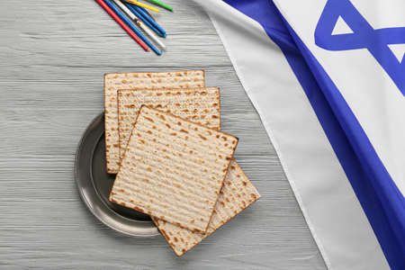 Jewish flatbread matza, candles and flag of Israel on wooden backgroundの写真素材