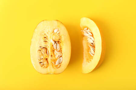 Ripe cut pumpkin on color backgroundの写真素材