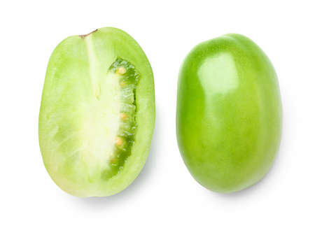 Halves of fresh green tomato on white backgroundの写真素材